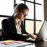 **

A person sitting at a desk, surrounded by papers and a laptop, looking thoughtfully at their resume. Light is streaming in from a window. The scene should convey a sense of reflection and strategic planning, highlighting the "Reframing Your Existing Skill Set" section. Consider adding subtle visual cues suggesting transferable skills like communication or organization (e.g., sticky notes with keywords, a well-organized workspace).

**